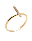 A dainty 14k yellow gold ring, with a vertical bar on top, set with nine tiny white diamonds.