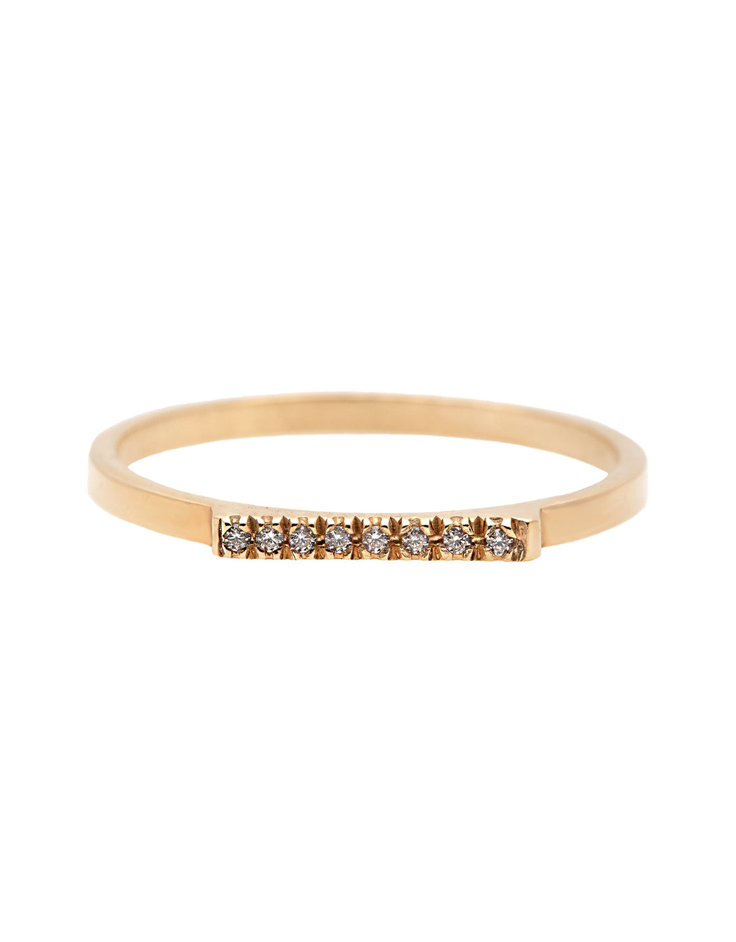 A delicate 14k yellow gold ring with a flat top set nine brilliant cut white diamonds, 0.01 carat each.