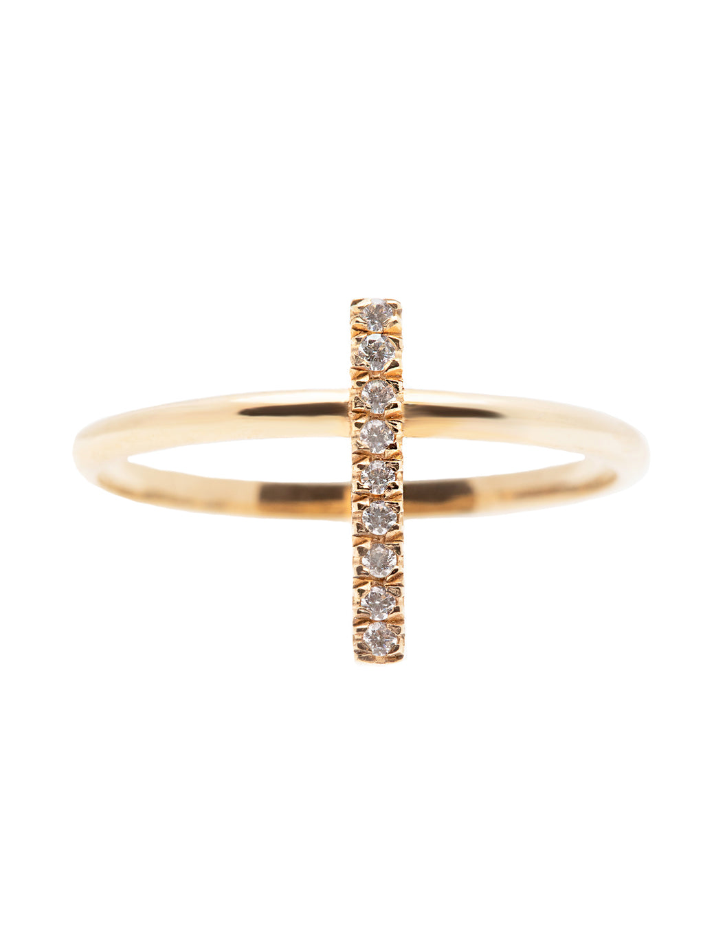 A dainty 14k yellow gold ring, with a vertical bar on top, set with nine tiny white diamonds.