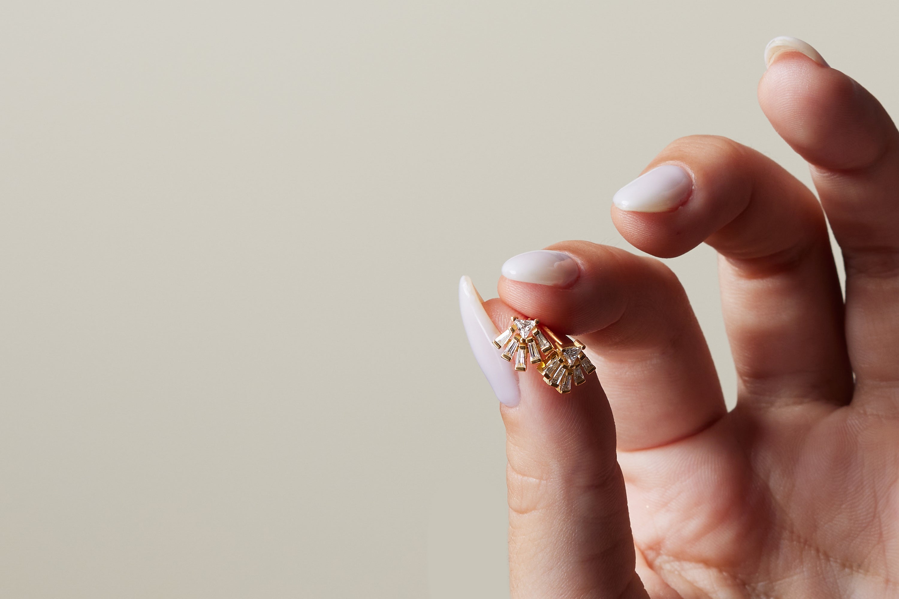 Fan shaped diamond earrings with tapered baguette cut diamonds
