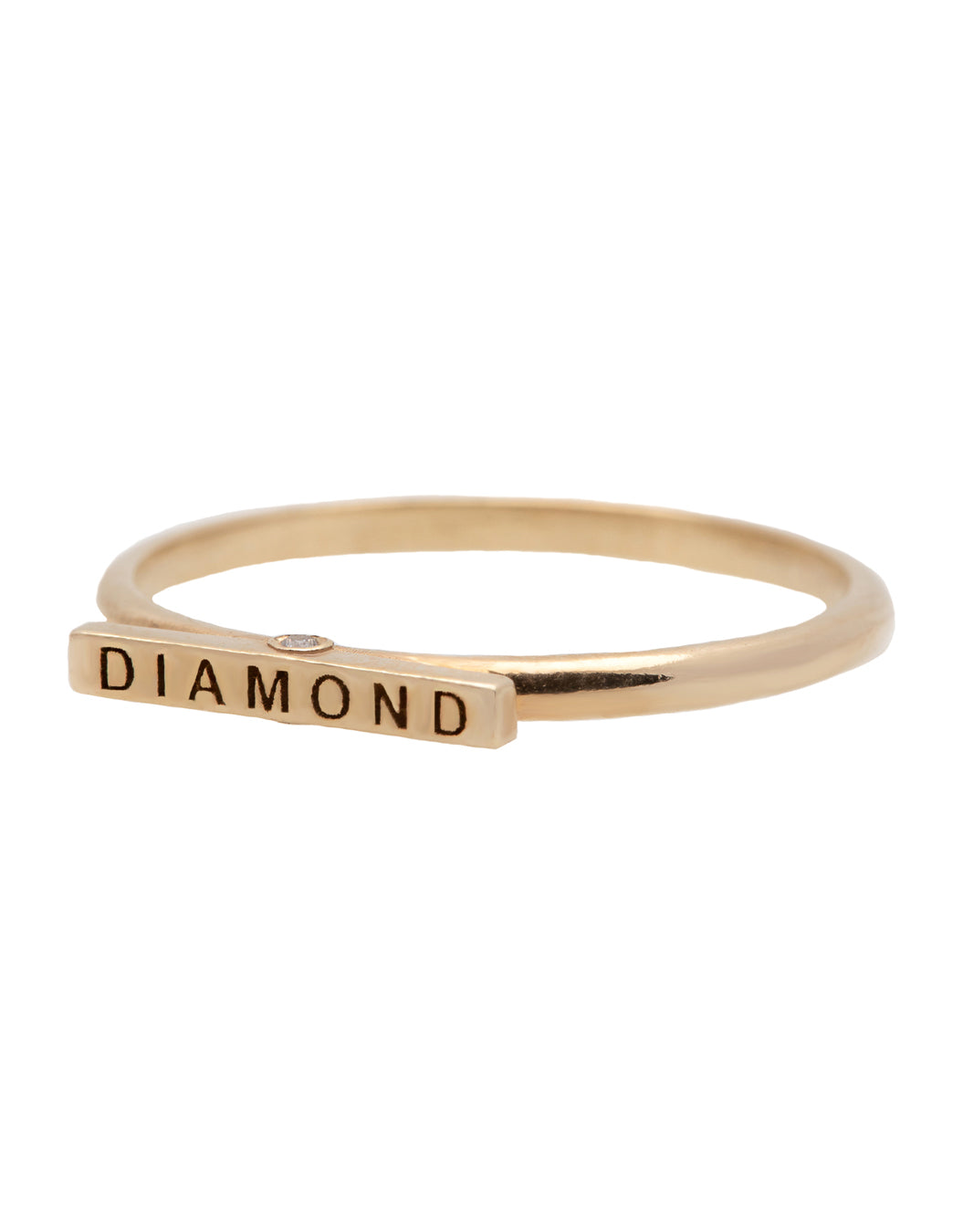 A delicate 14k yellow gold ring, engraved with DIAMOND on top and set with two tiny white diamonds.