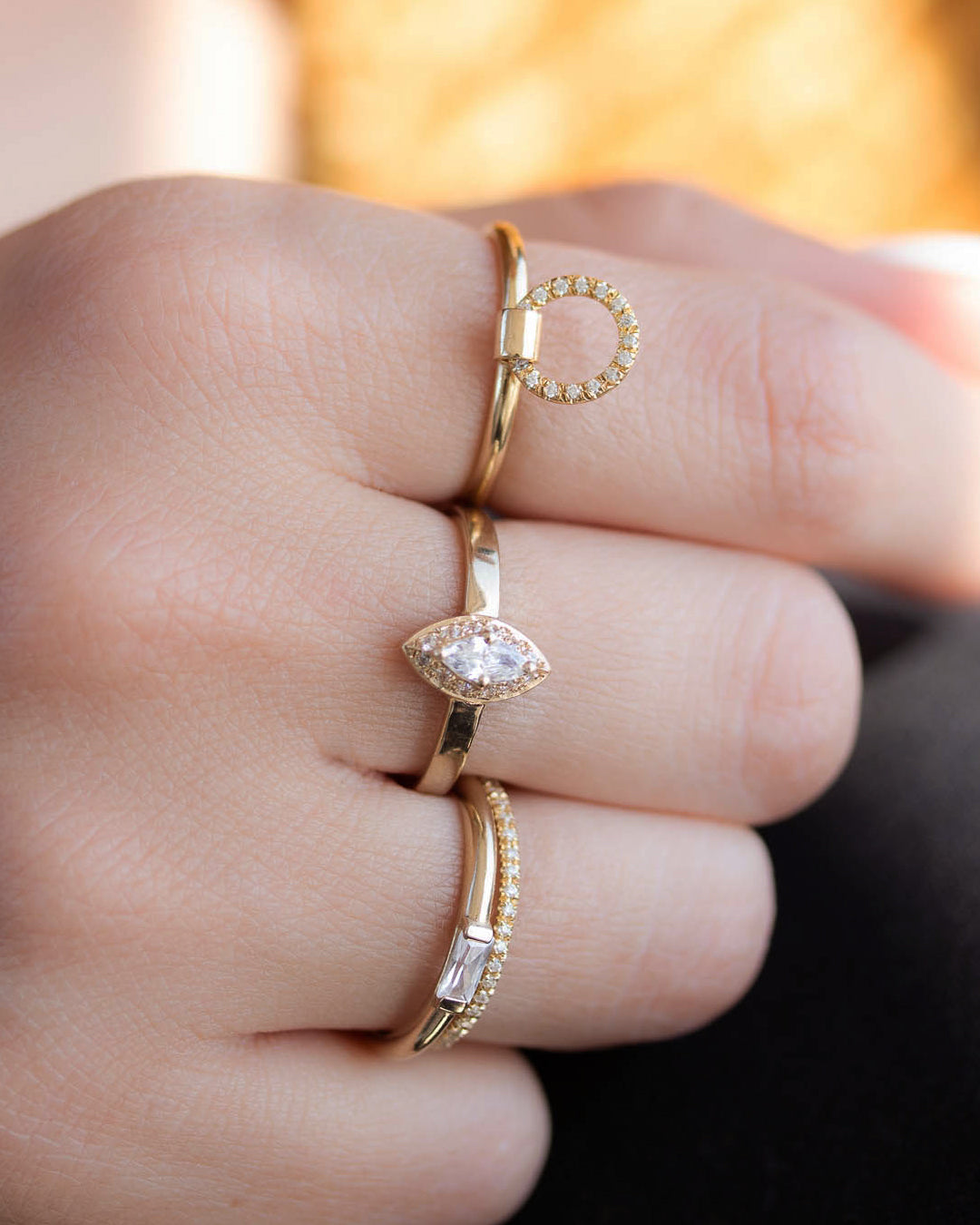 A  delicate 14k yellow gold engagement ring, set with a 0.25 baguette cut white diamond. 