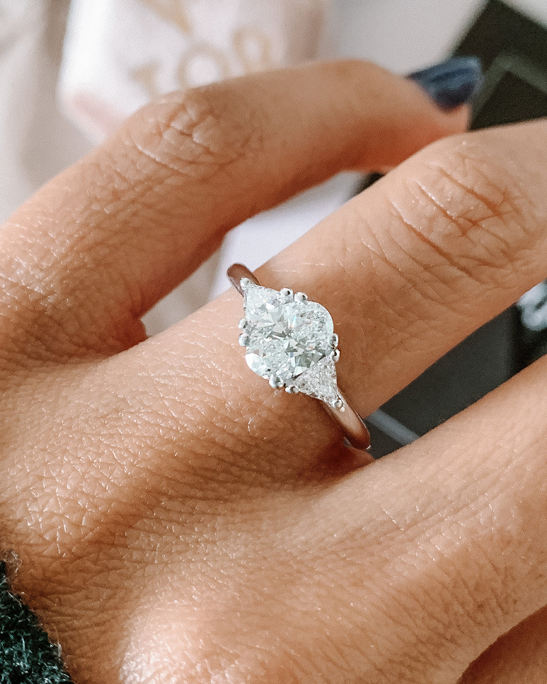 Niva Engagement Ring with Oval Cut and Triangle Cut Diamonds