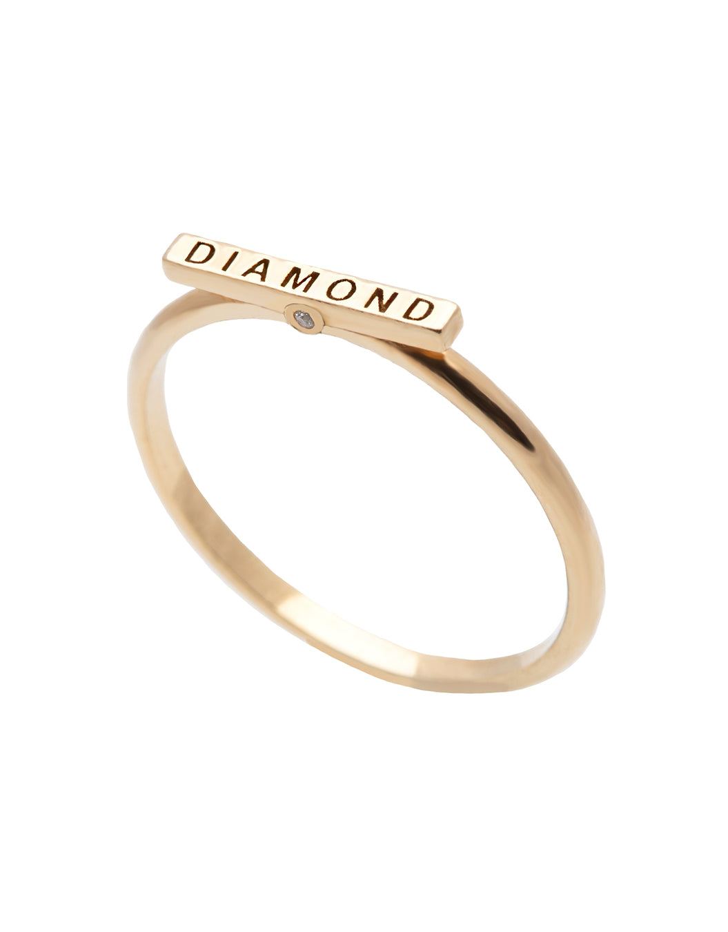 A delicate 14k yellow gold ring, engraved with DIAMOND on top and set with two tiny white diamonds.