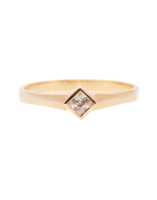 A delicate 14k yellow gold engagement ring set with a center 0.25 carat princess cut white diamond. 