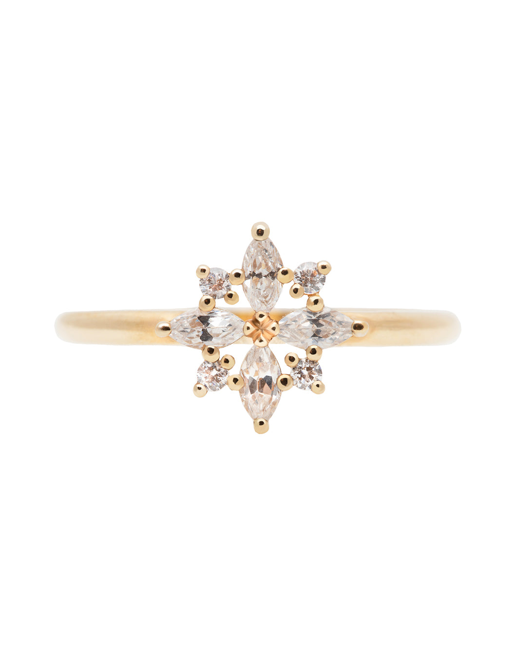 A delicate 14k yellow gold engagement ring set with four marquise cut white diamonds, and four brilliant cut white diamonds, in a shape of a snowflake.