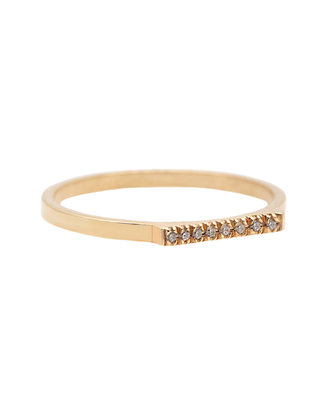 A delicate 14k yellow gold ring with a flat top set nine brilliant cut white diamonds, 0.01 carat each. 