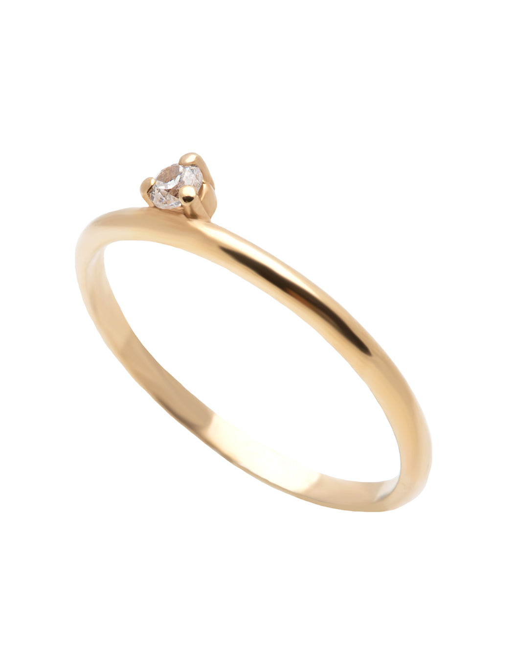 A dainty 14k yellow gold ring, set with one tiny, brilliant cut white diamond.